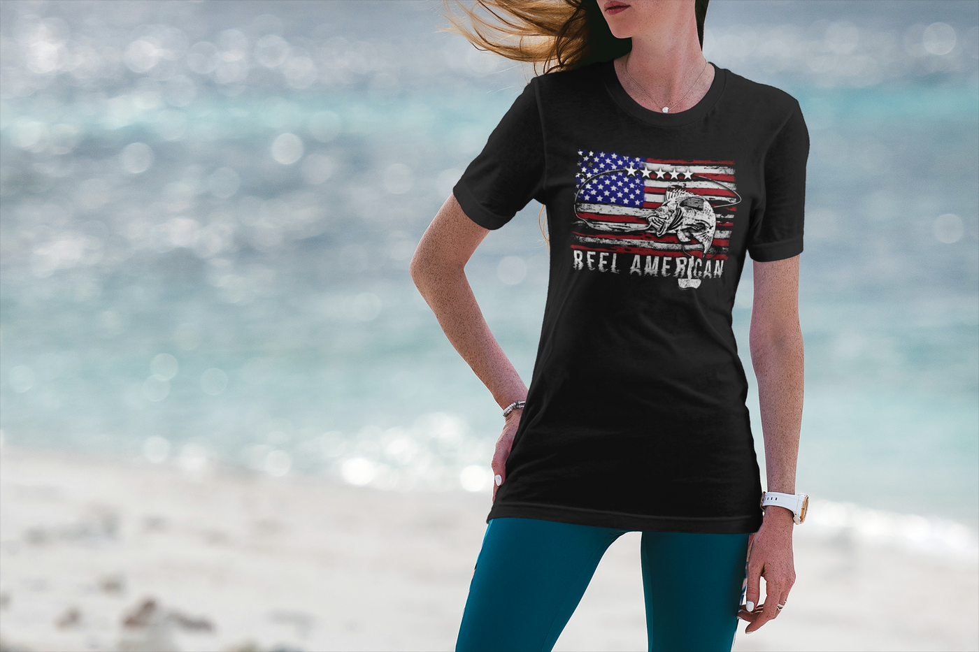 Picture of a woman by the water wearing American Heritage Gift's Reel American Tri-Blend T-Shirt